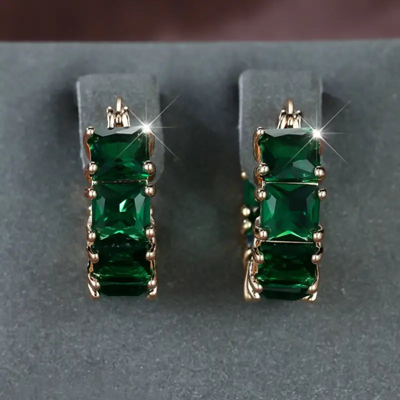 Boucles d'oreilles créoles épaisses en or et émeraude