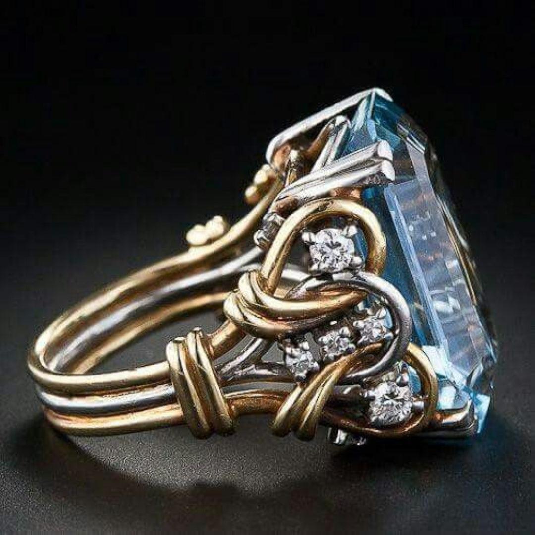 Bague en or avec zircon bleu dans un style vintage