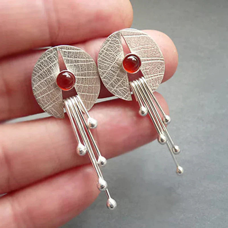 Boucles d'oreilles pendantes en pierre rouge creuse