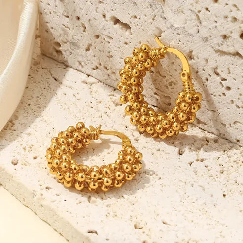 Boucles d'oreilles créoles en perles dorées