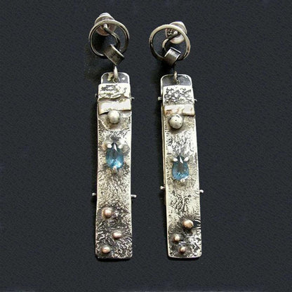 Boucles d'oreilles faites à la main en pierre bleue