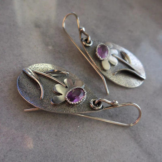 Boucles d'oreilles rétro avec des fleurs tridimensionnelles