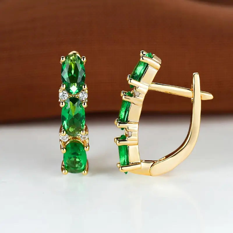 Boucles d'oreilles créoles verticales en or et émeraude