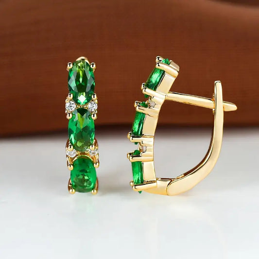 Boucles d'oreilles créoles verticales en or et émeraude