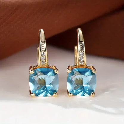 Boucles d'oreilles créoles en or avec pierres précieuses mystiques