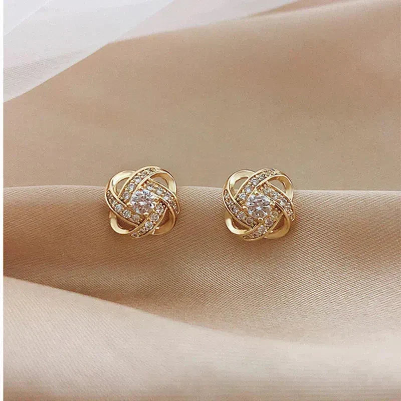 Boucles d'oreilles Croix Spirale Fleur