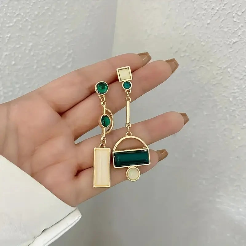 Boucles d'oreilles géométriques pendantes en or émeraude