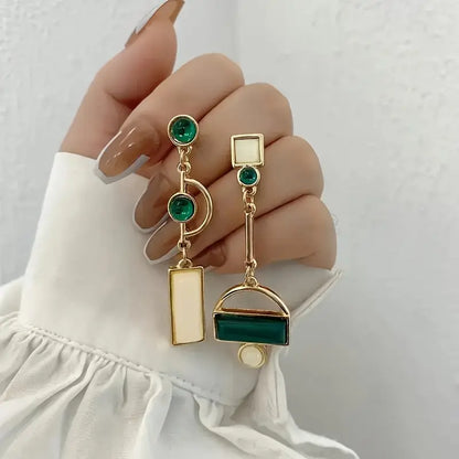 Boucles d'oreilles géométriques pendantes en or émeraude