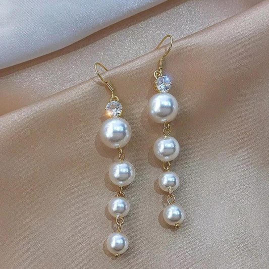 Boucles d'oreilles en pendentif perle dorée