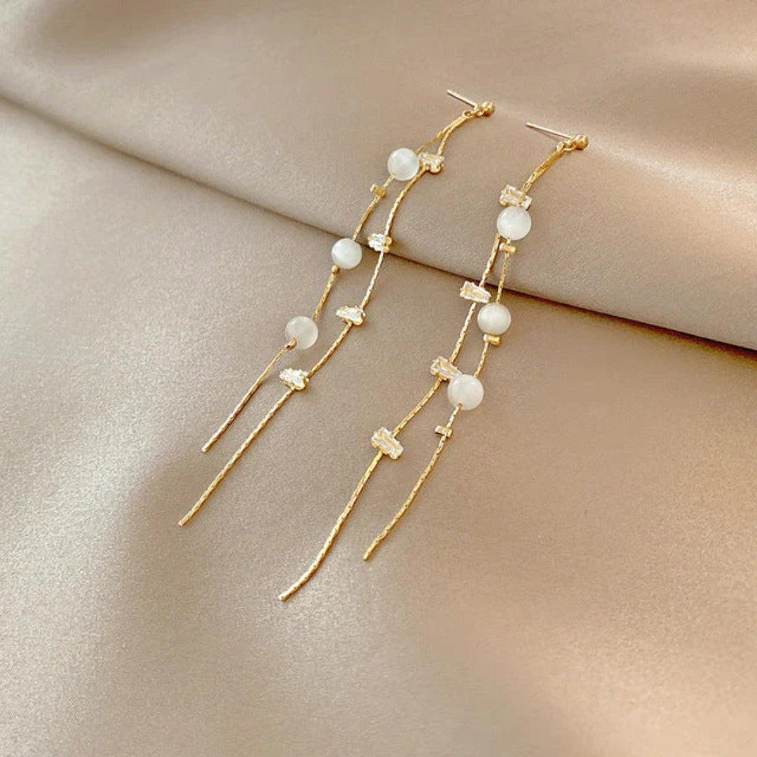 Boucles d'oreilles pendantes élégantes avec perles et zircon
