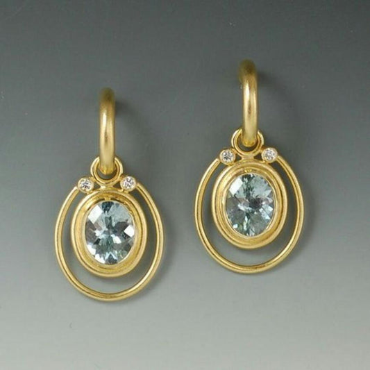Boucles d'oreilles vintage dorées avec incrustation de cristal bleu