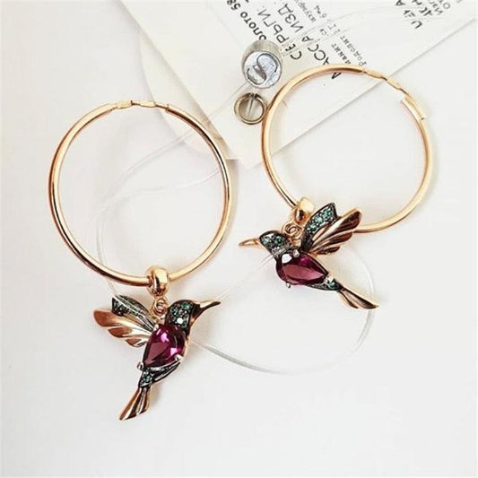 Boucles d'oreilles en édition limitée avec colibri volant et incrustation de zircon