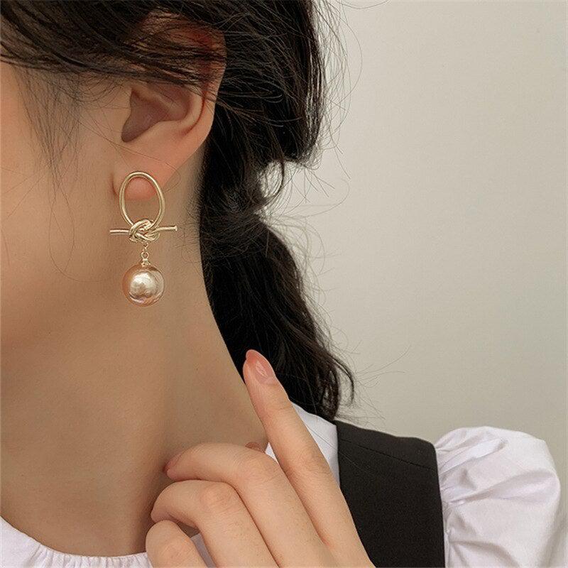 Boucles d'oreilles en boucle de perles dorées