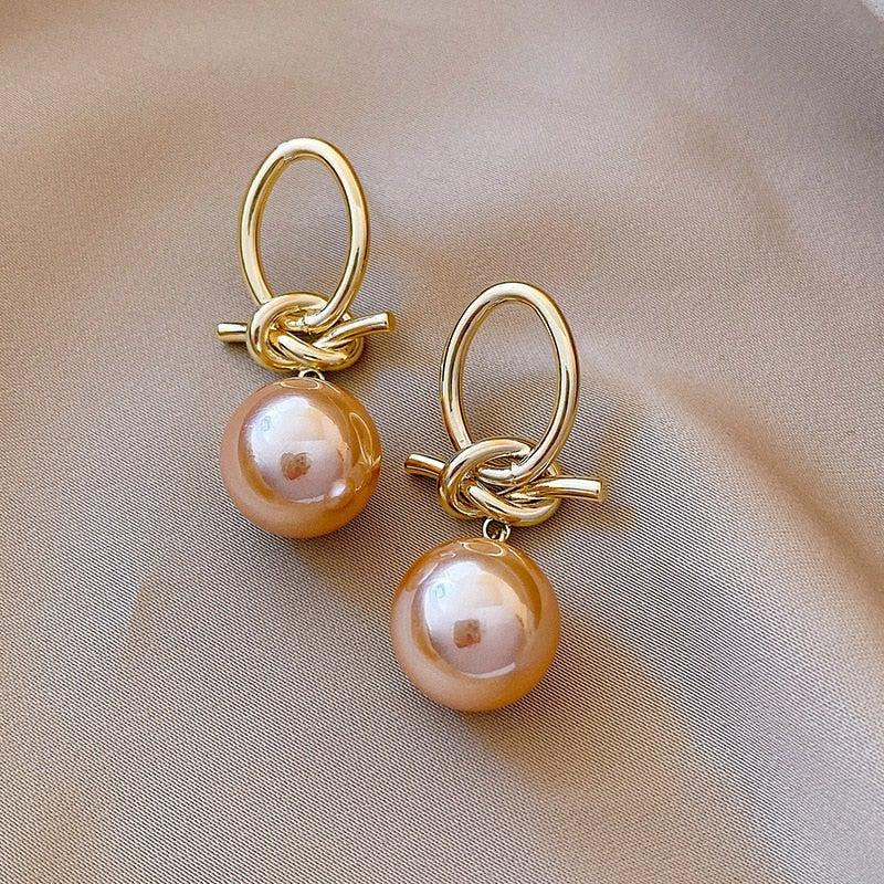 Boucles d'oreilles en boucle de perles dorées