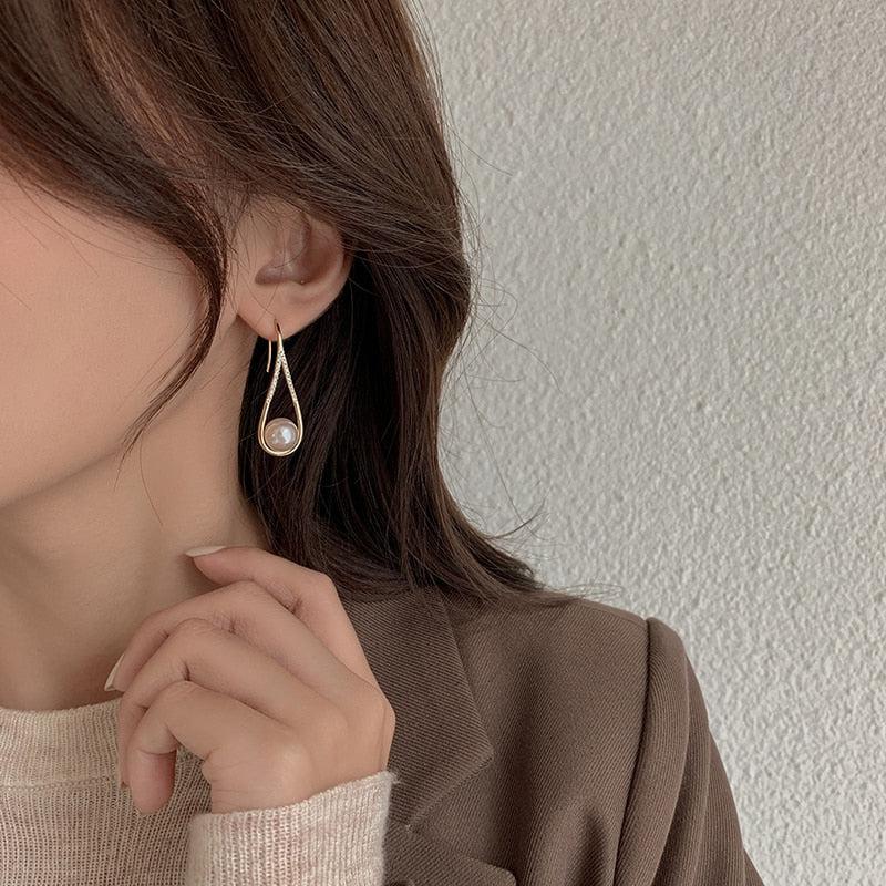 Boucles d'oreilles en perles rose doré