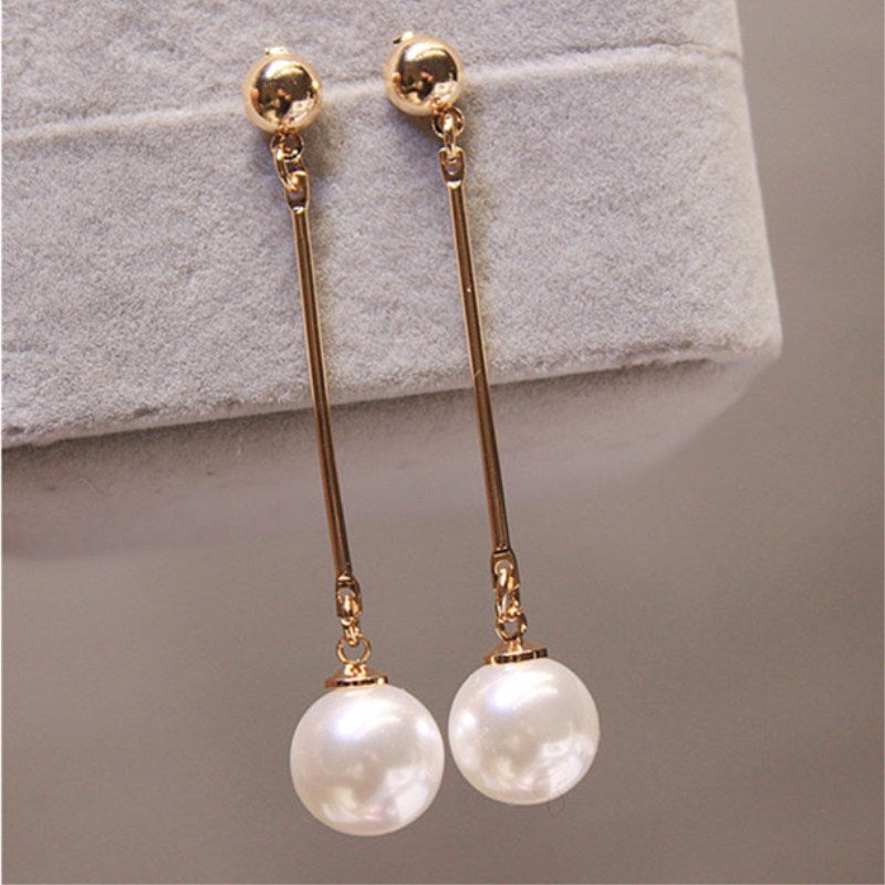 Boucles d'oreilles pendantes en perles dorées