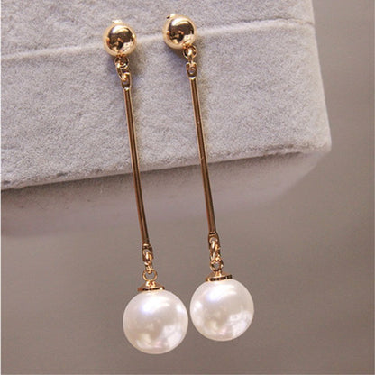 Boucles d'oreilles pendantes en perles dorées