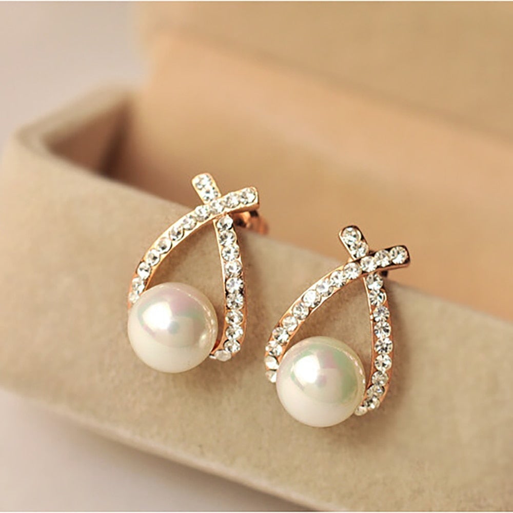 Boucles d'oreilles en perles croisées dorées