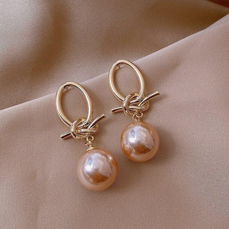 Boucles d'oreilles en boucle de perles dorées