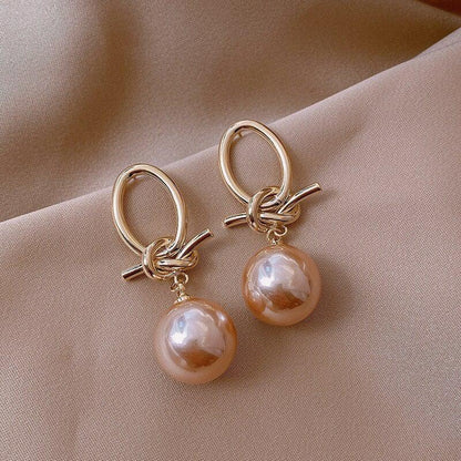 Boucles d'oreilles en boucle de perles dorées