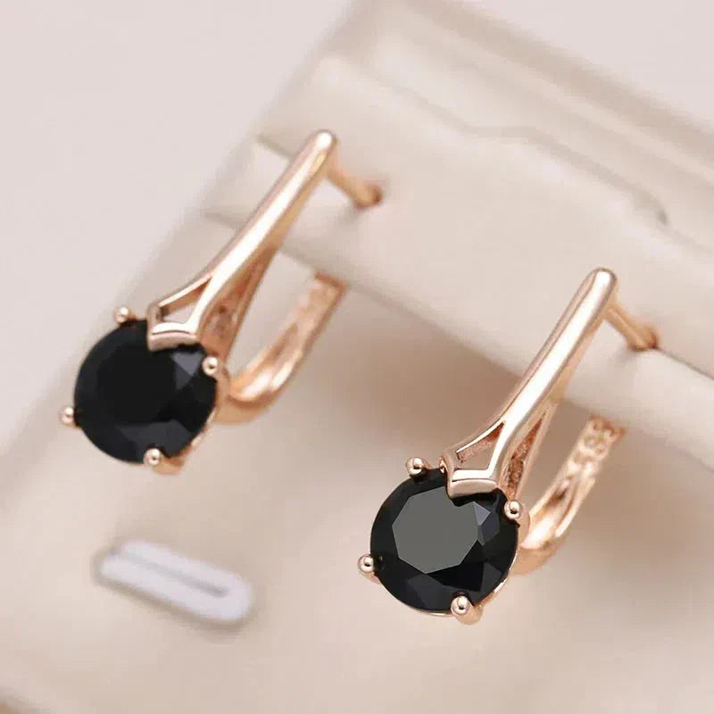 Boucles d'oreilles élégantes en cristal noir doré