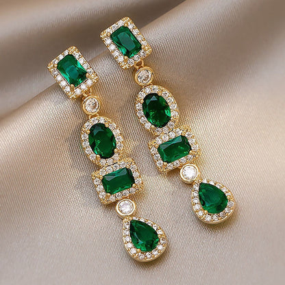 Boucles d'oreilles pendantes en or et émeraude multi-formes