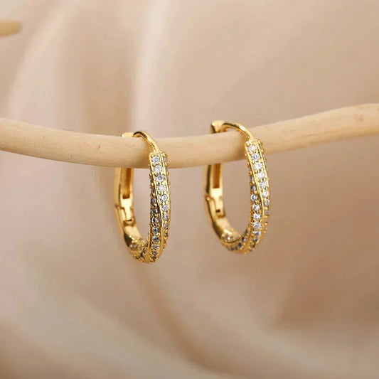 Boucles d'oreilles dorées brillantes irrégulières minimalistes