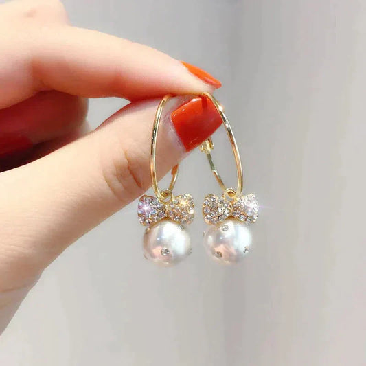 Boucles d'oreilles en or brillant avec perles
