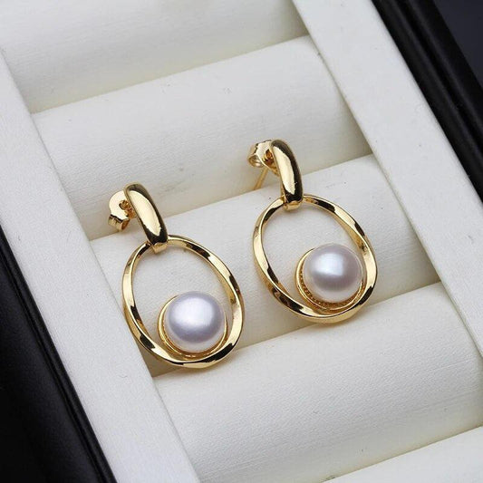 Boucles d'oreilles élégantes en or et perles