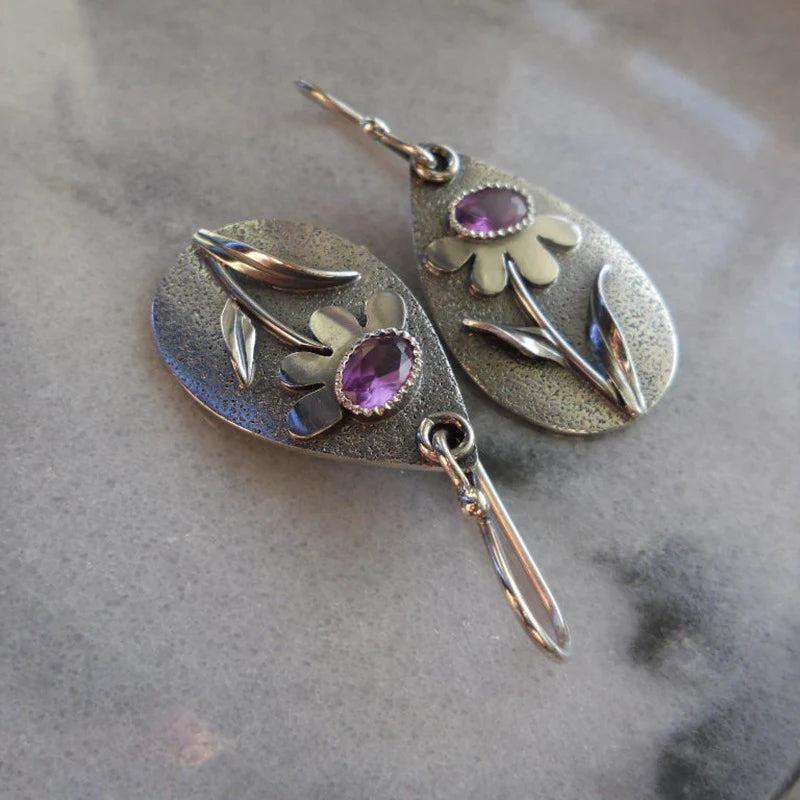 Boucles d'oreilles rétro avec des fleurs tridimensionnelles