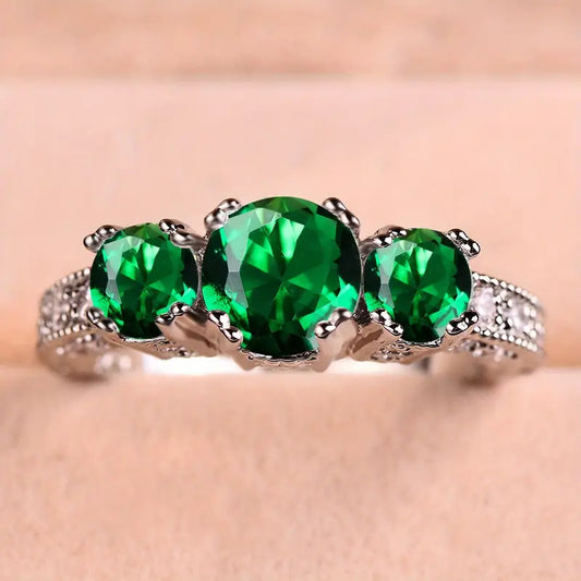 Bague en Argent et Émeraudes à Trois Pierres