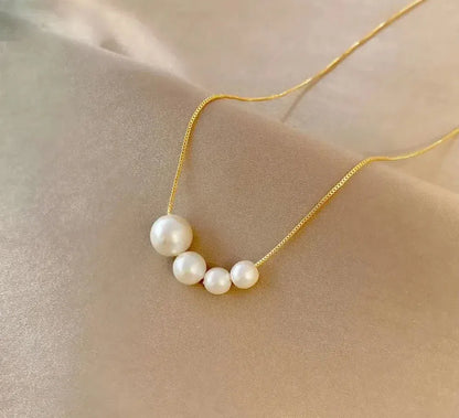 Collier en perles d'eau douce dorées