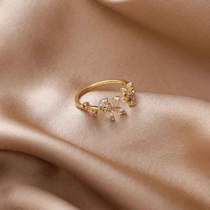 Bague ajustable avec des feuilles en cristal doré