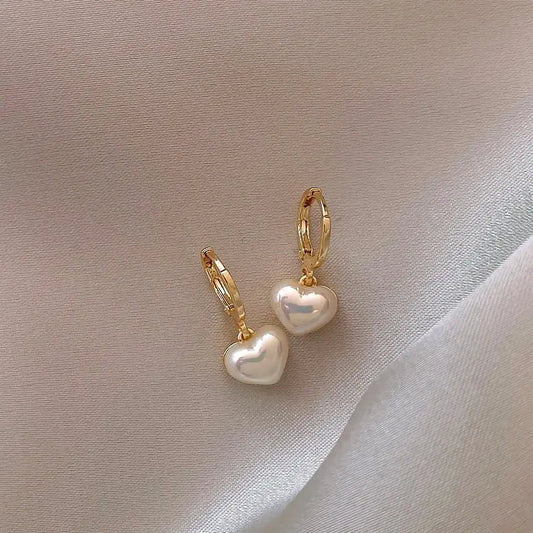 Boucles d'oreilles en perles dorées en forme de cœur