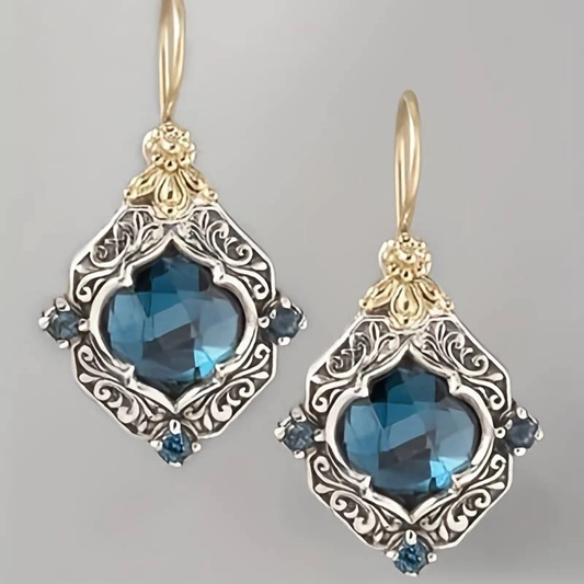 Boucles d'oreilles en cristal bleu en or et argent