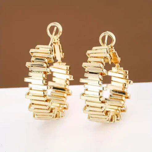 Boucles d'oreilles créoles irrégulières en or