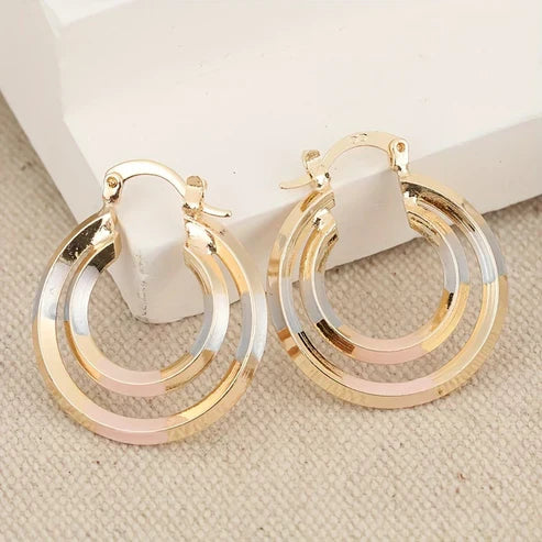 Boucles d'oreilles circulaires blanches et or rose
